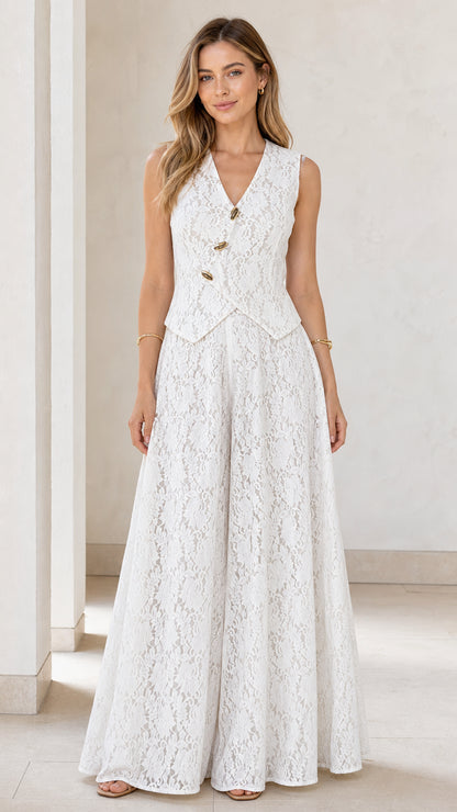 Front view of model wearing white lace vest and wide leg jumpsuit