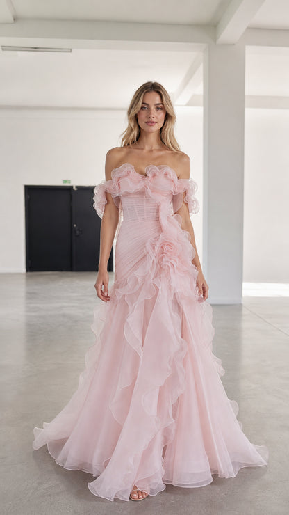 Front view of model wearing pink off-shoulder ruffled tulle evening gown