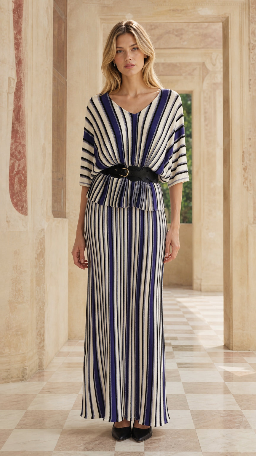 Front view of woman wearing blue striped two-piece maxi dress set