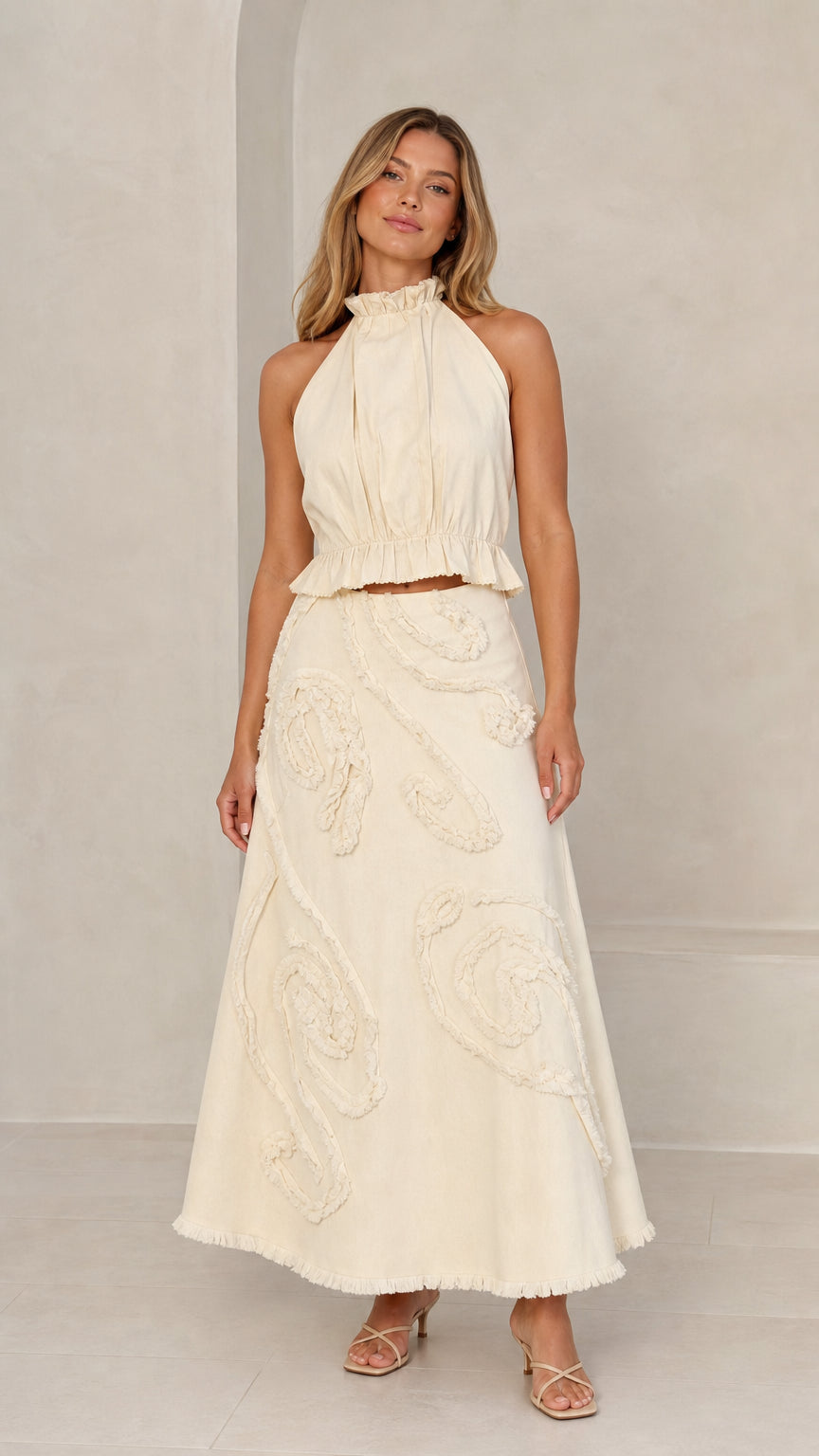 Front full view of Cream halter crop top and maxi skirt set