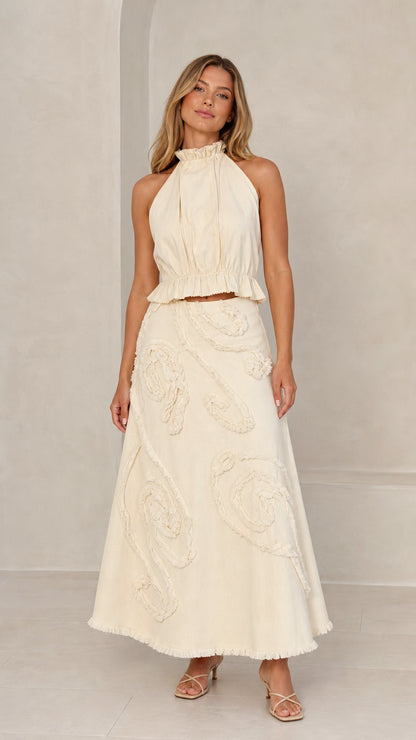 Front full view of Cream halter crop top and maxi skirt set
