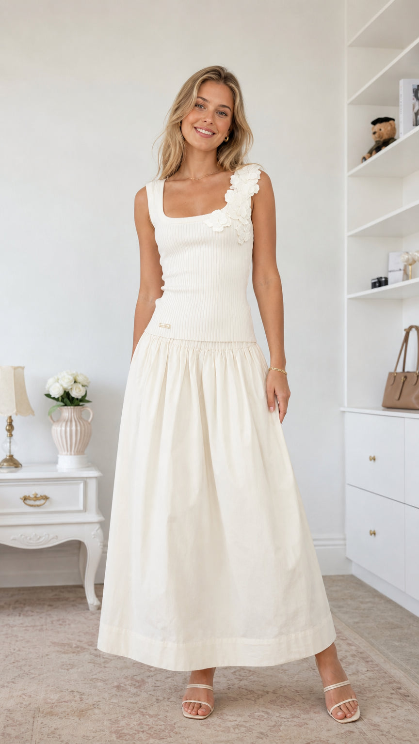 Front view of model wearing white floral applique midi dress