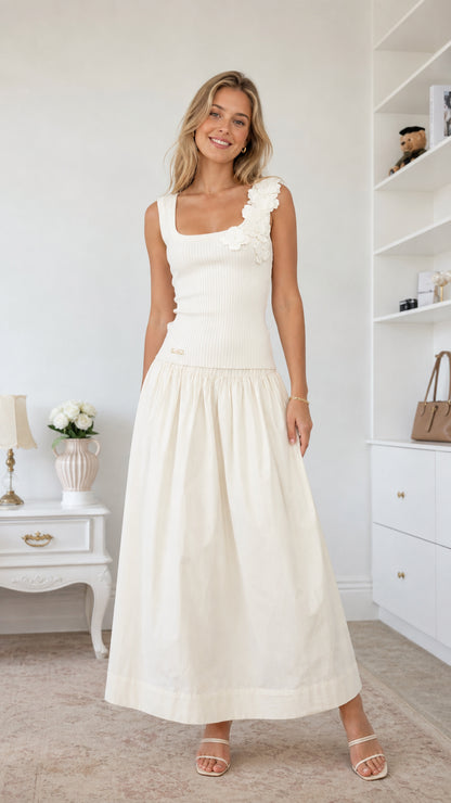 Front view of model wearing white floral applique midi dress