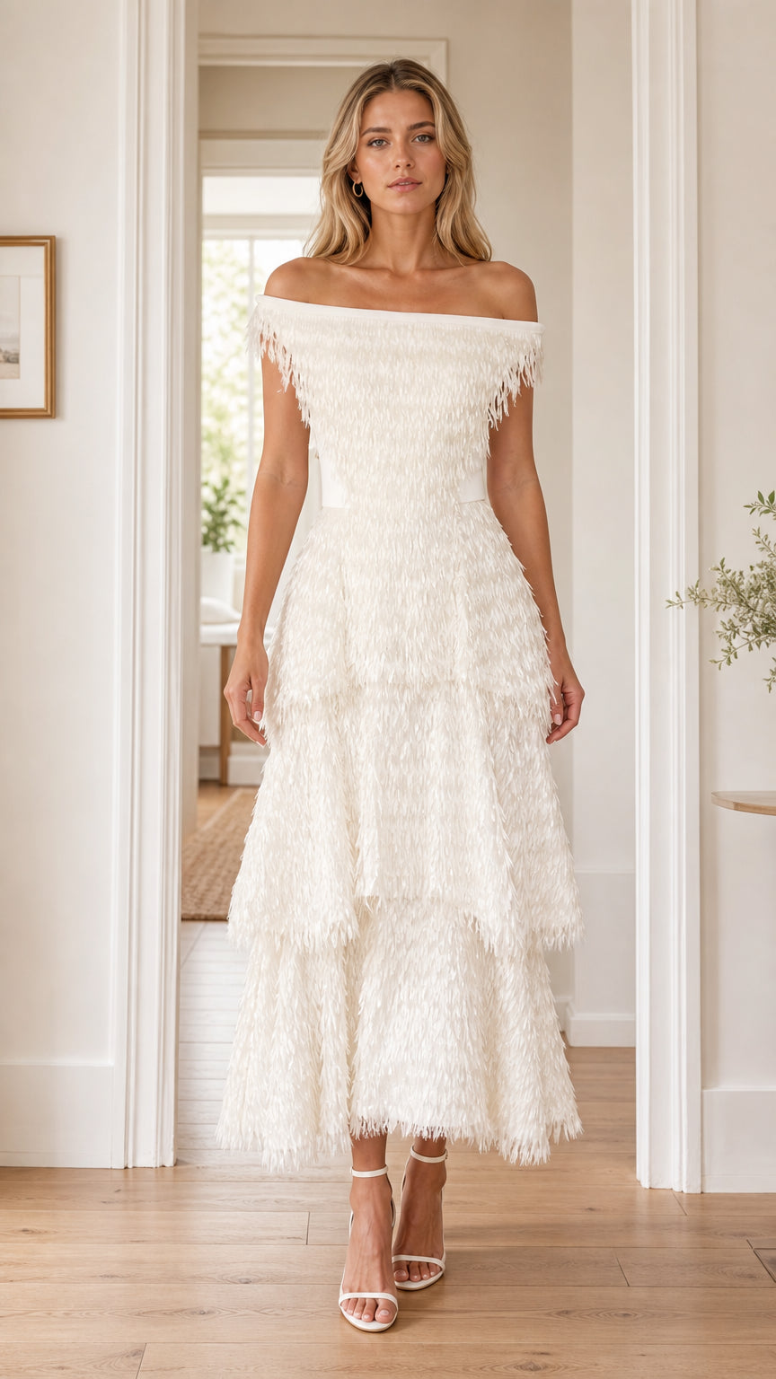 Front view of woman wearing white off-the-shoulder tiered fringe midi dress