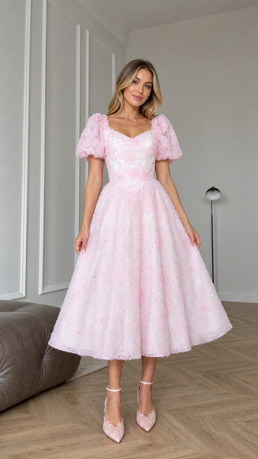 Front view of model wearing pink floral applique puff sleeve midi dress