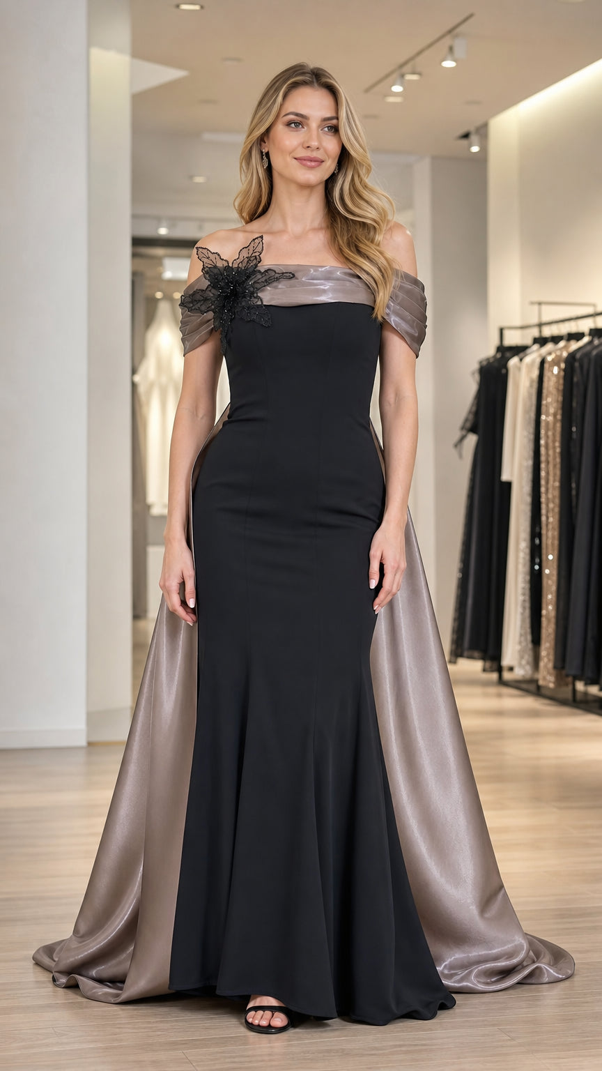 Front view of black off-shoulder evening gown with cape