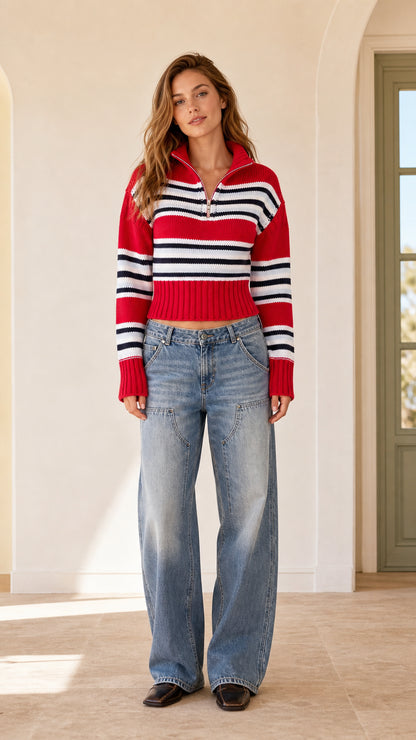 Front full view of woman wearing red striped quarter-zip cropped sweater with wide-leg jeans