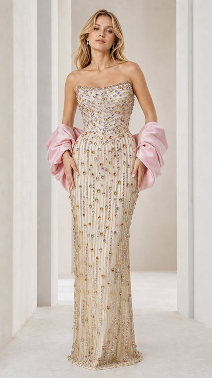 Front view of champagne beaded strapless evening gown with pink sleeves