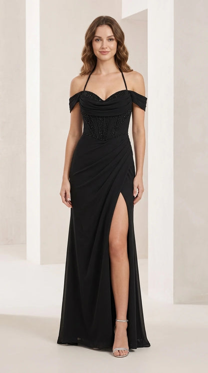 Front view of black beaded halter evening gown with slit