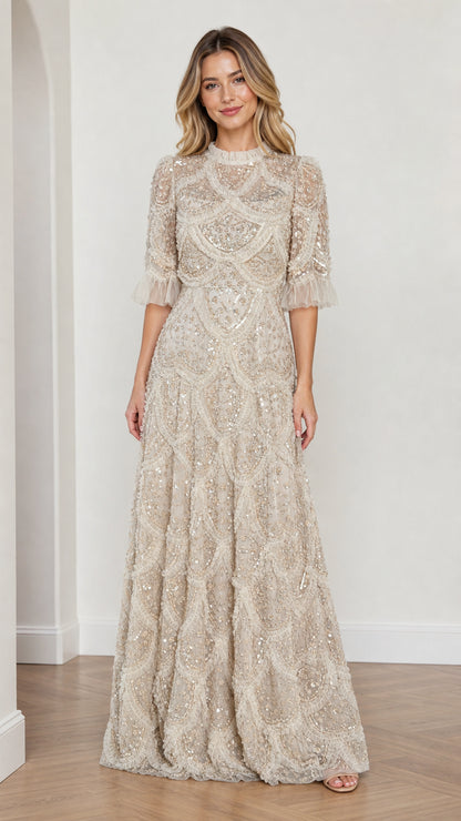 Model wearing Champagne embellished ruffle mock neck maxi dress, front view