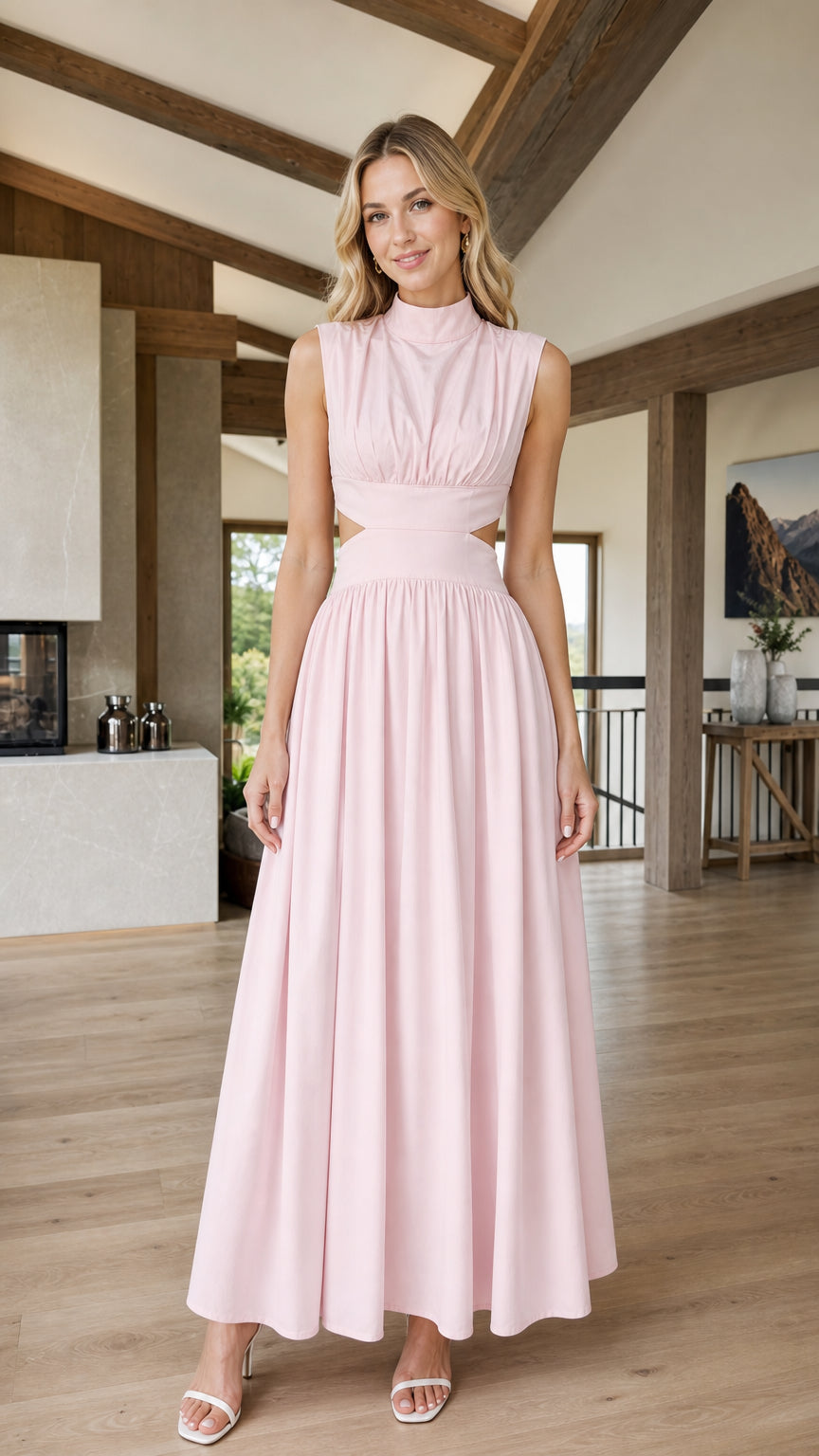 Front view of woman wearing pink mock neck cutout maxi dress