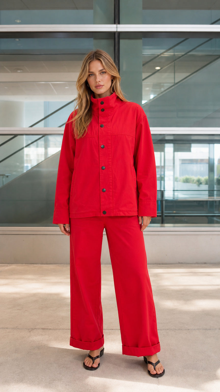 Front view of woman wearing red two-piece utility jacket and wide-leg pants set