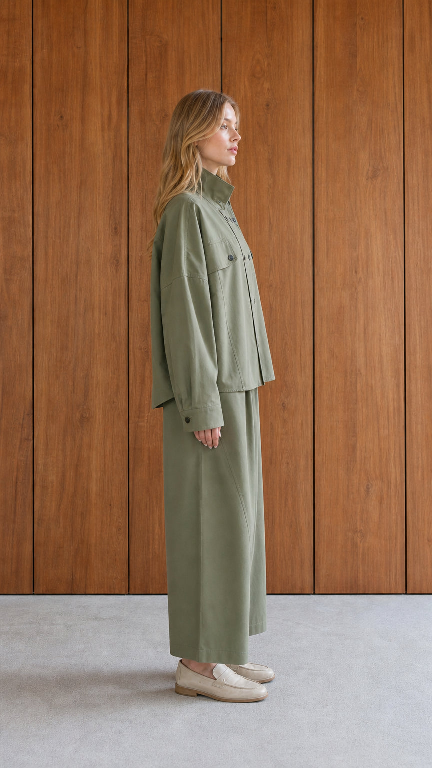 Side profile of woman in sage green matching set