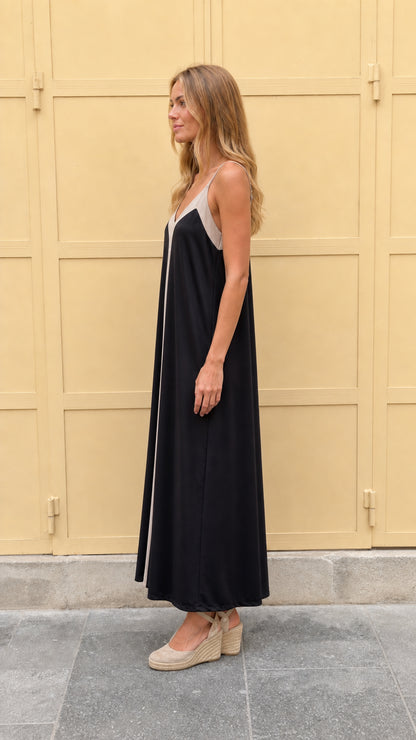 Side profile view of black contrast maxi dress