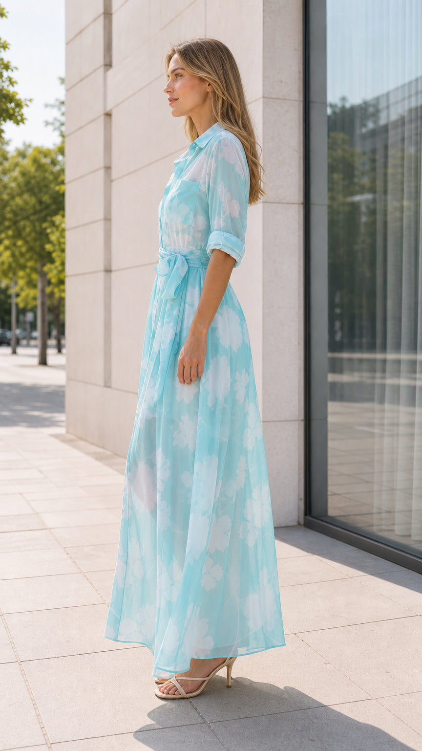 Aqua floral maxi shirt dress shown from the side with flowing skirt
