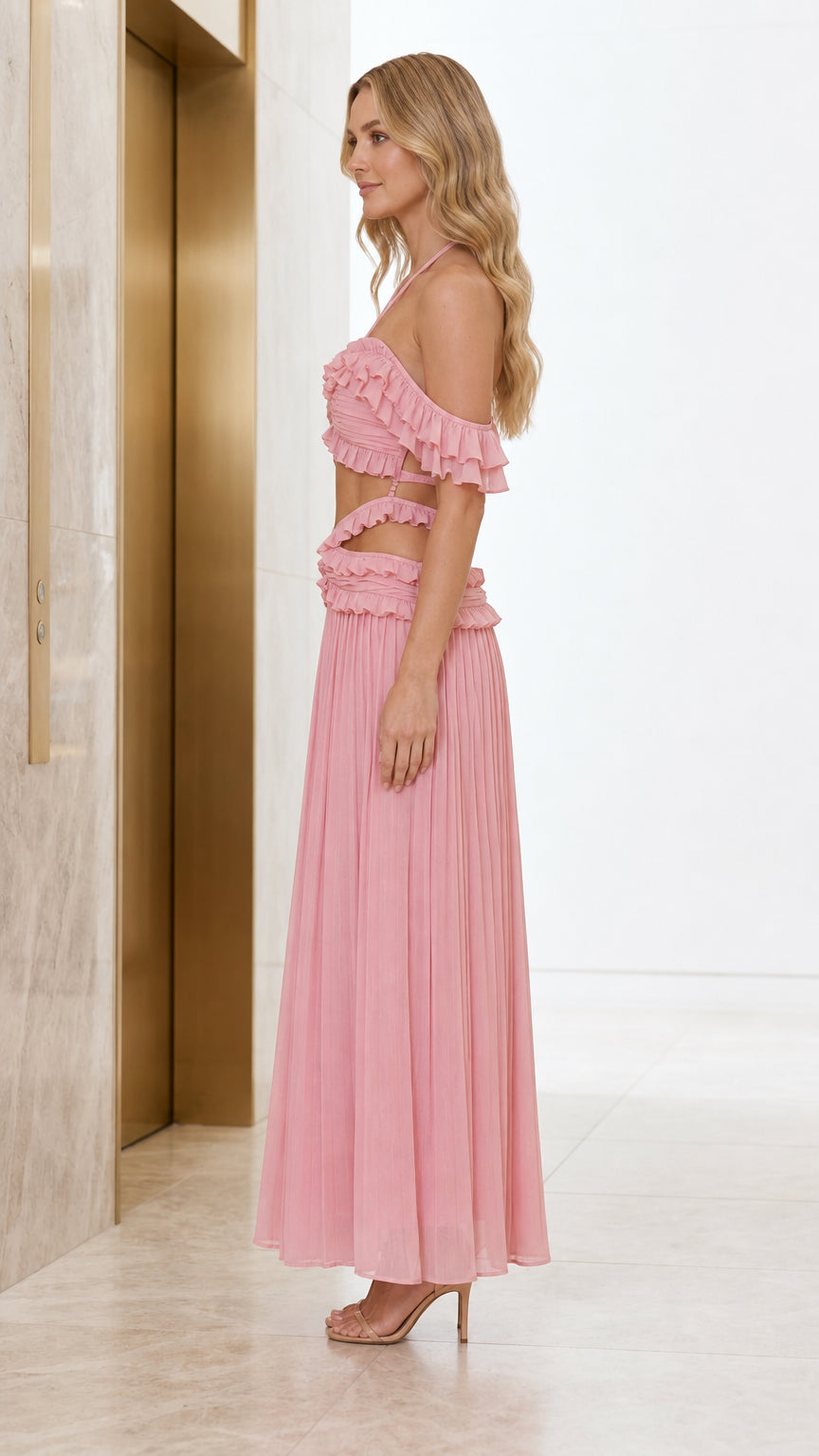 Side profile view of model in pink two-piece set