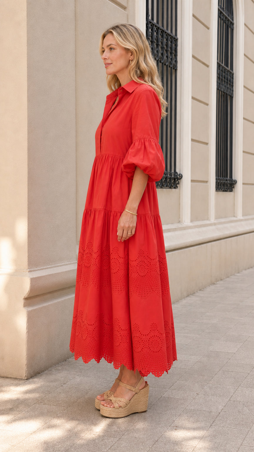 Side profile of woman in red midi dress with wedge sandals