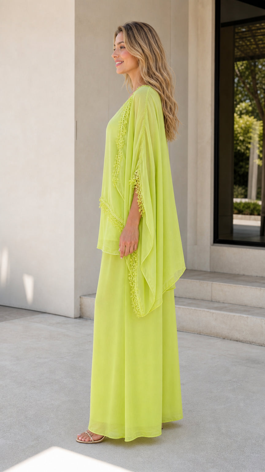 Side profile of model in lime green 3-piece cape set