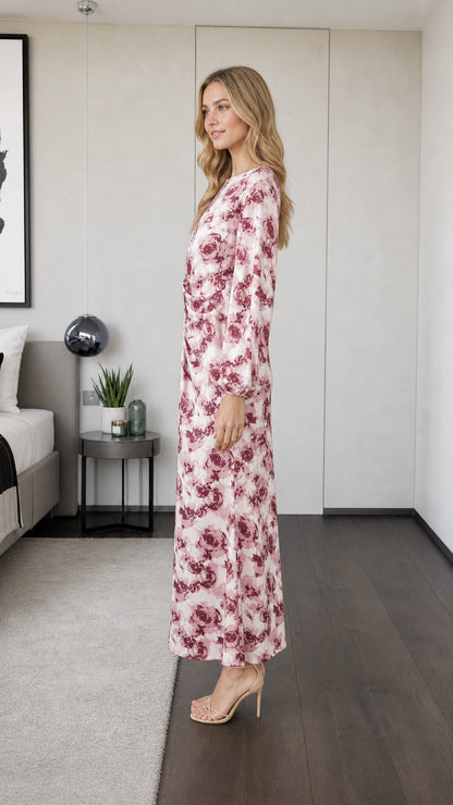 Side profile view of model in pink floral maxi dress