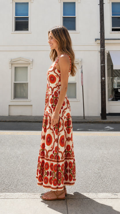 Side view of model in red floral maxi dress outdoors
