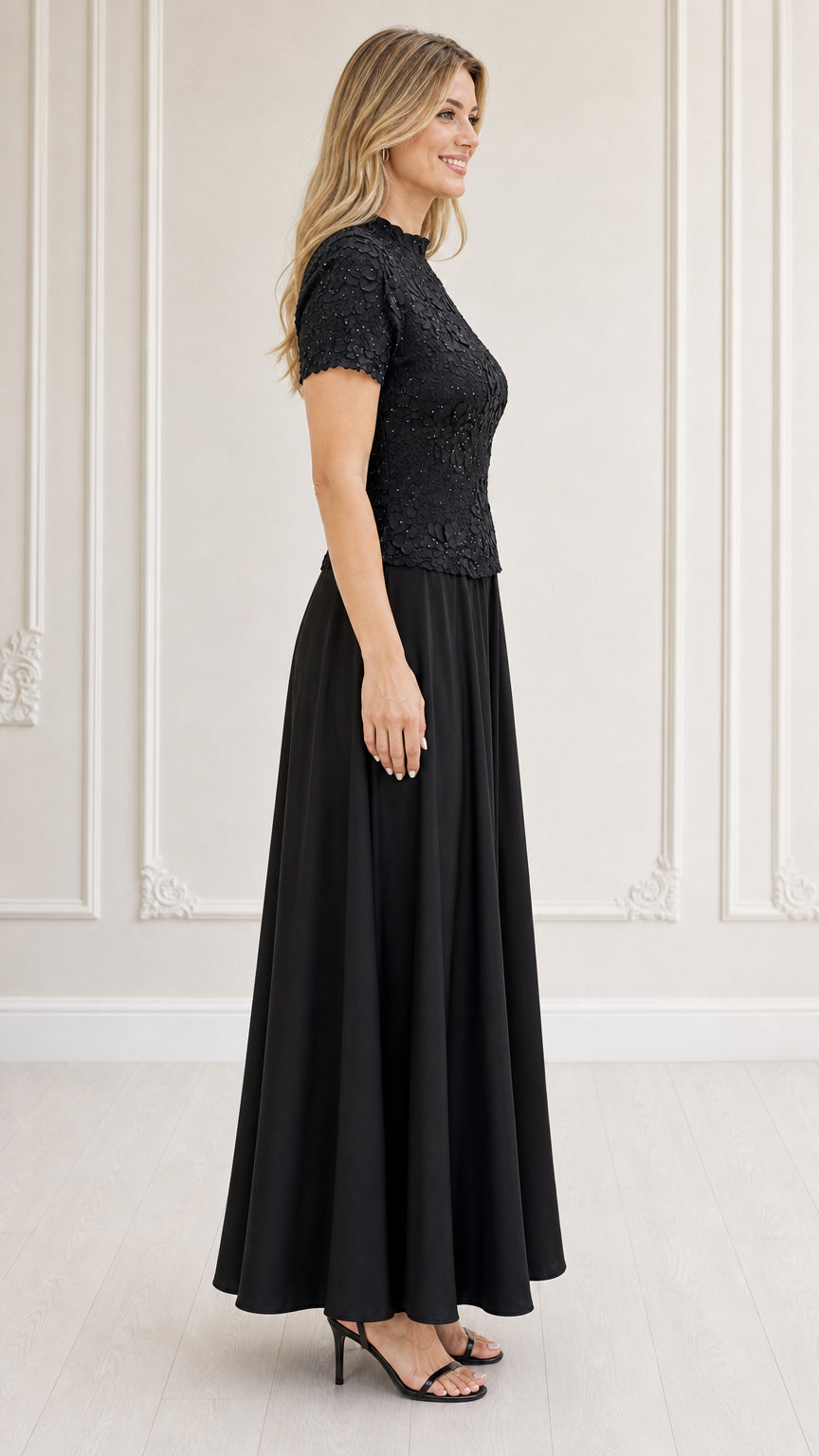 Side profile of model in black evening maxi dress