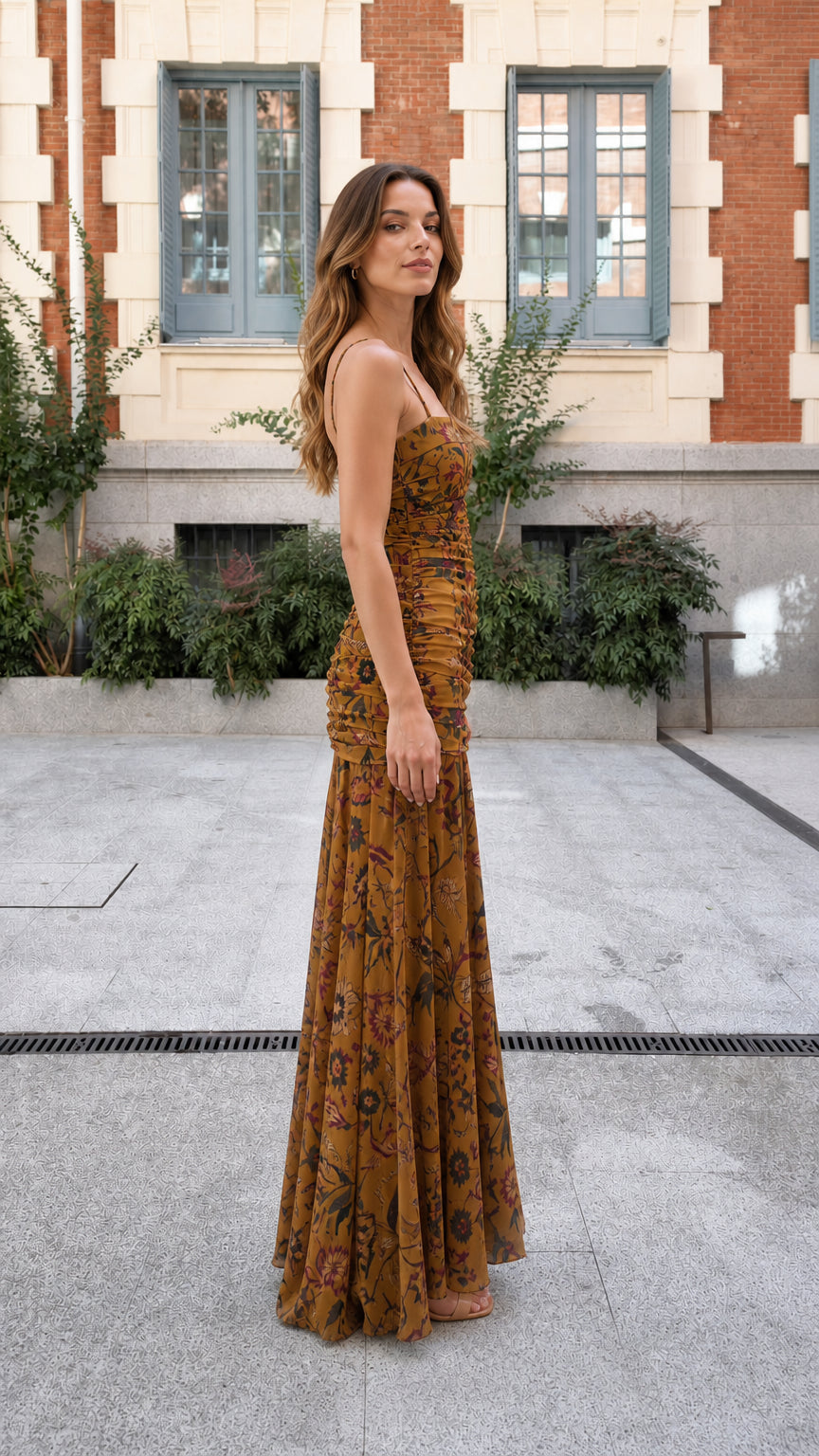 Side profile view of mustard floral ruched maxi dress