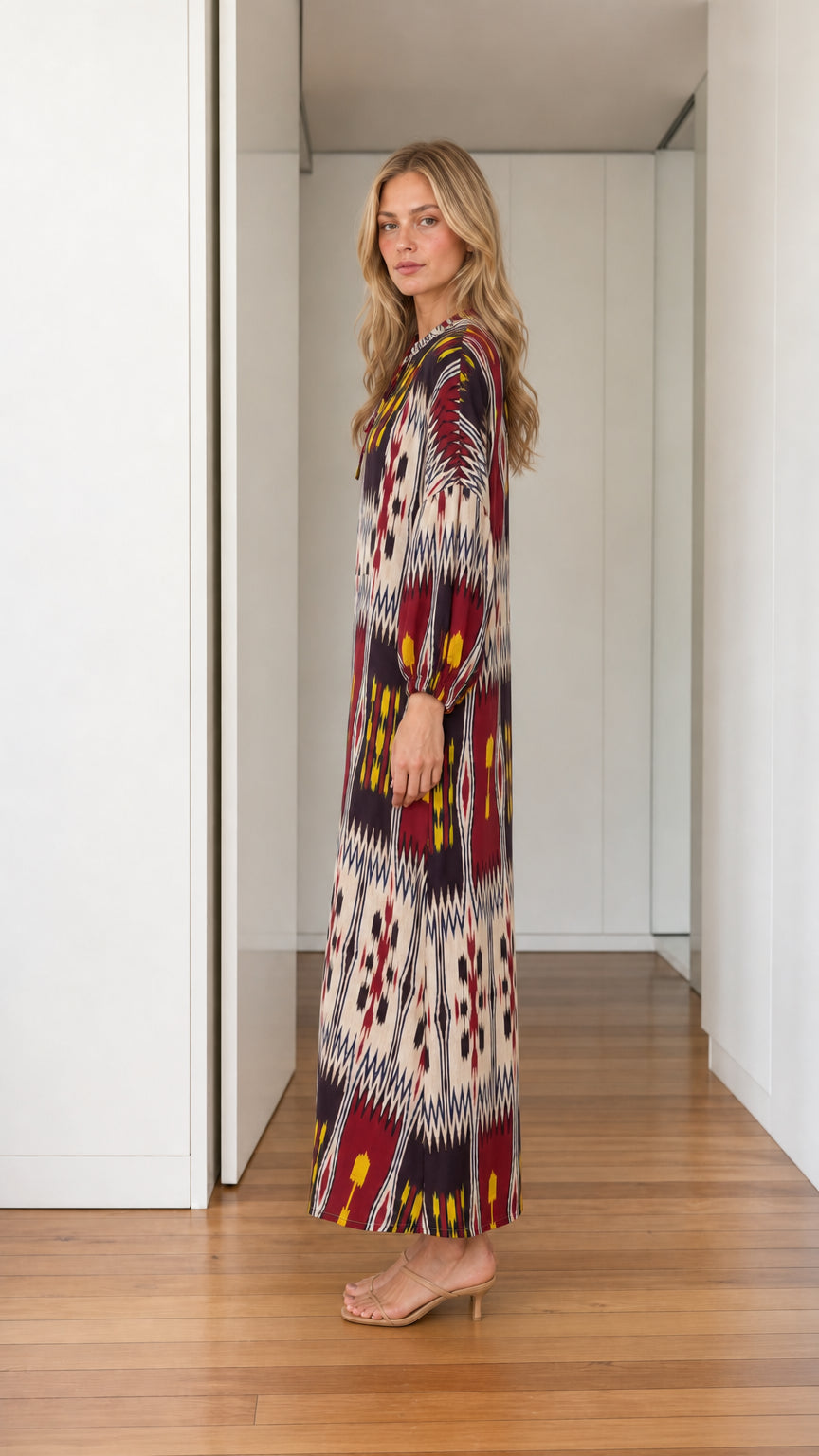 Side profile view of burgundy maxi dress