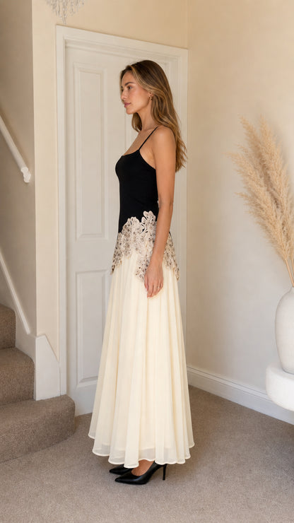 Side profile view of Black long dress