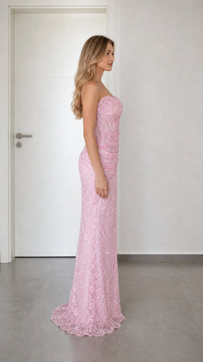 Side profile view of pink strapless evening dress