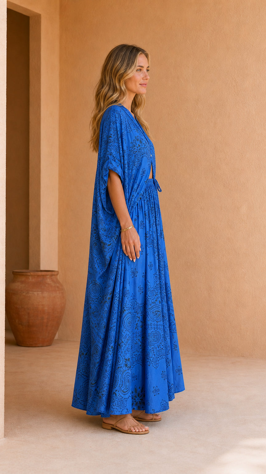 Model wearing blue printed two-piece set, side profile