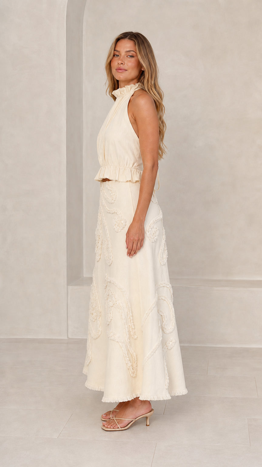 Side profile view of Cream two-piece set