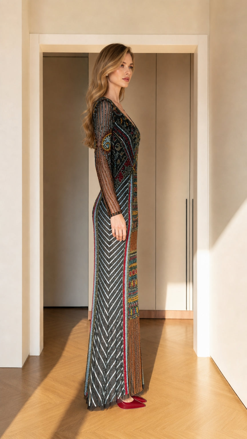 Side profile of black multicolor beaded floor-length formal gown