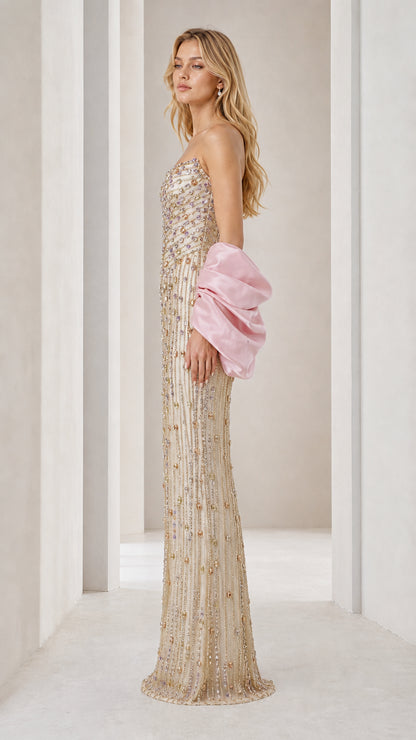 Side profile view of champagne beaded gown