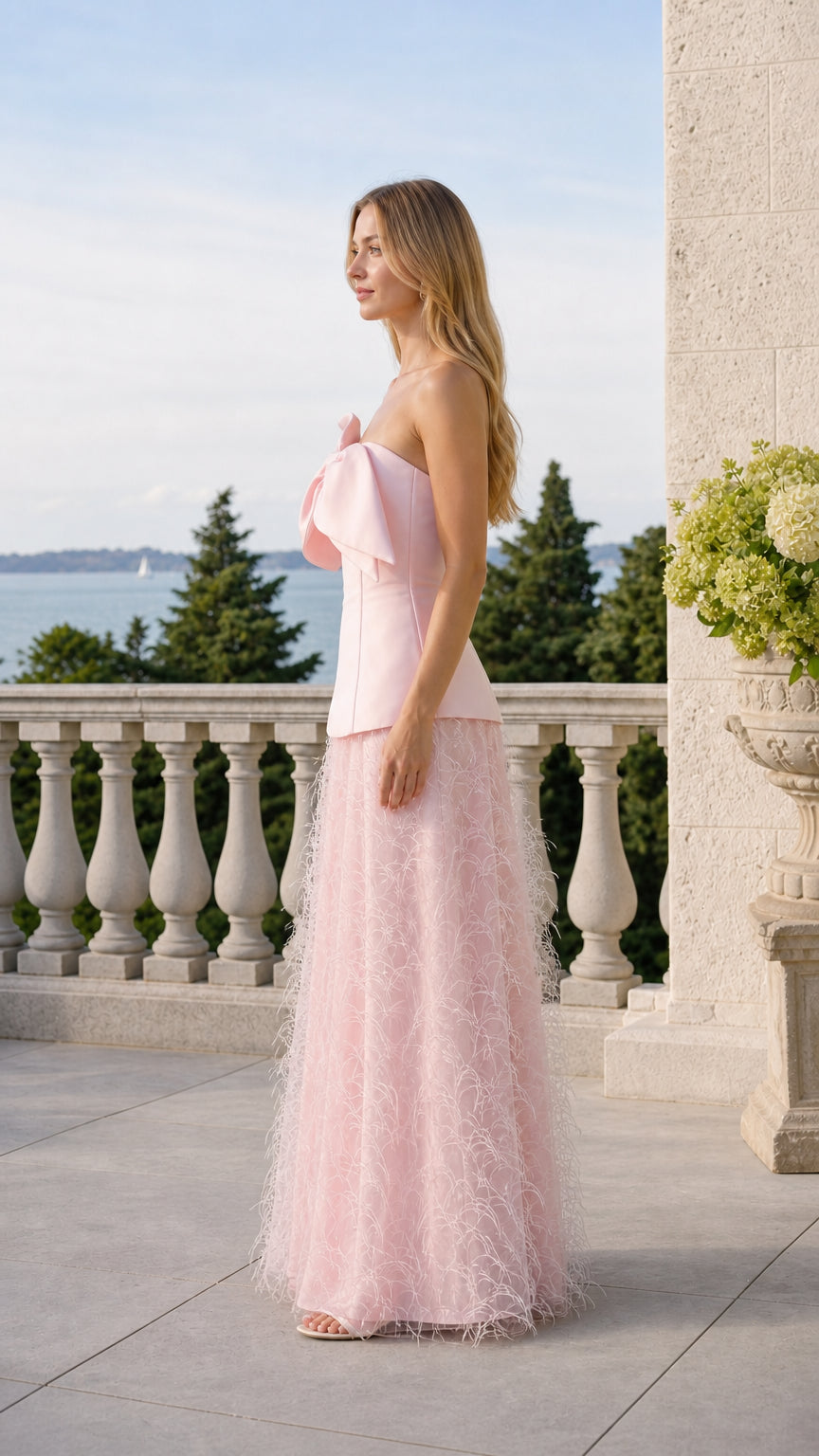 Side profile view of pink two-piece set on model