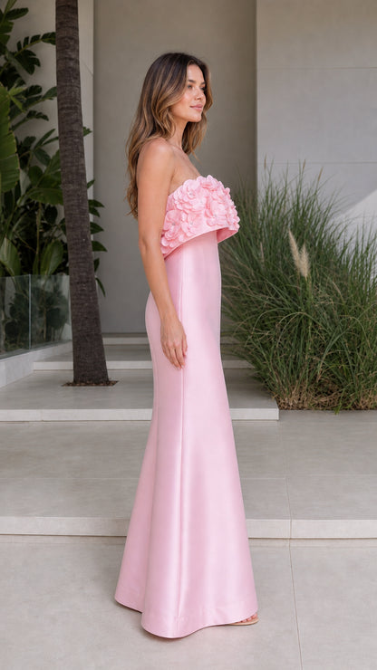 Side profile view of pink satin formal evening gown