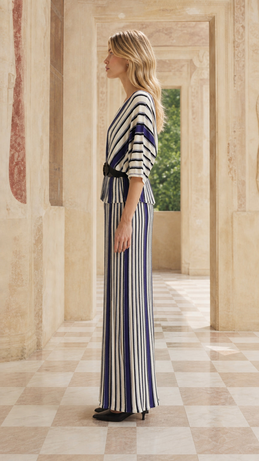 Side profile of woman in blue striped maxi set