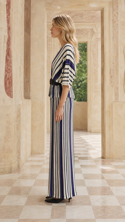 Side profile of woman in blue striped maxi set
