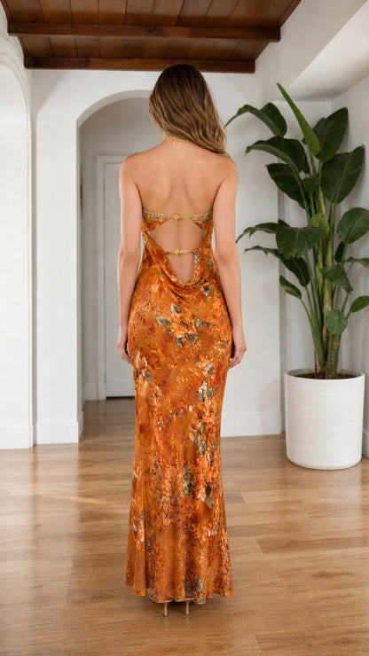 Back view highlighting the cowl back and rhinestone straps on Orange dress