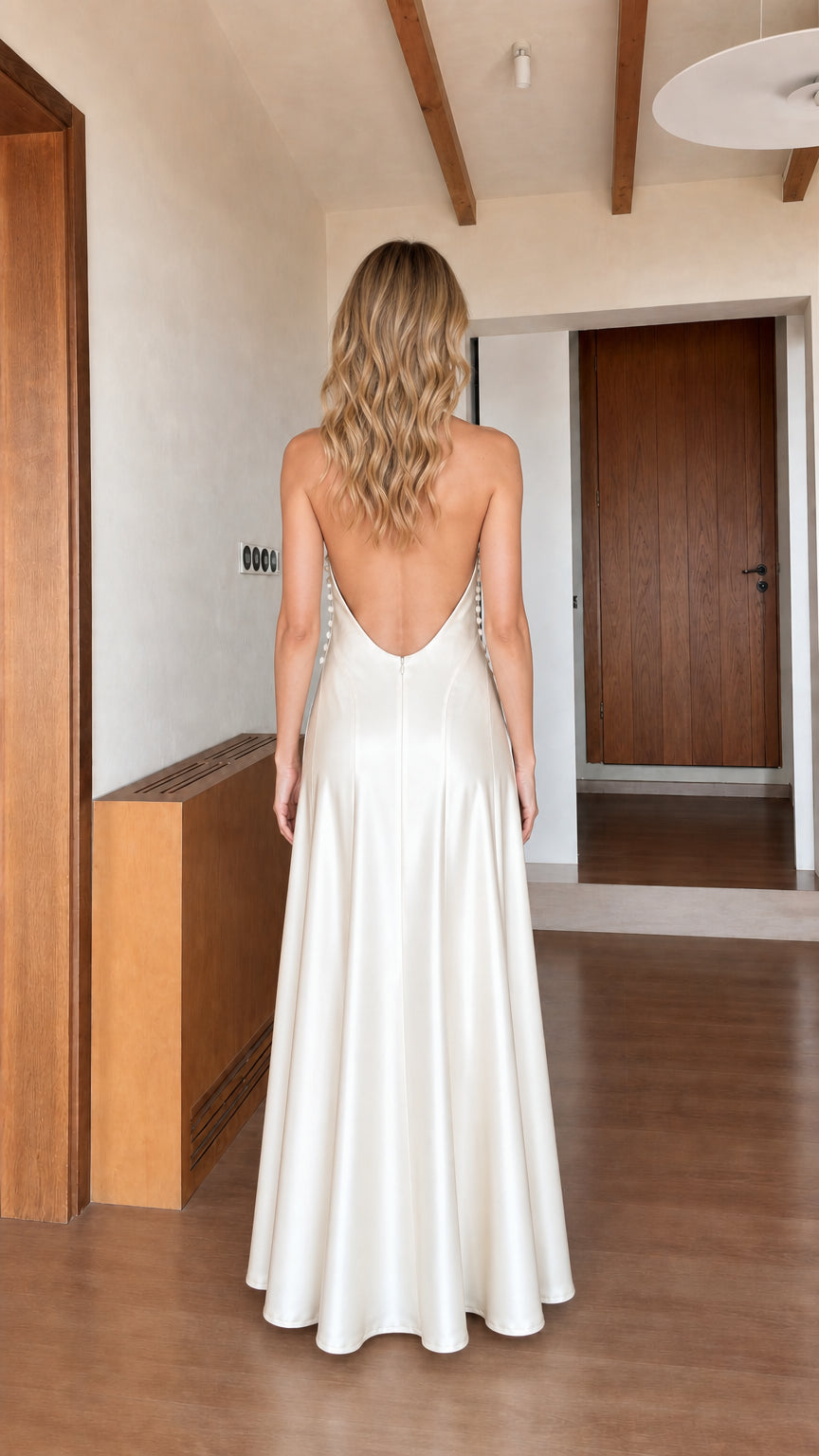 Back view showcasing open back design of ivory satin maxi dress