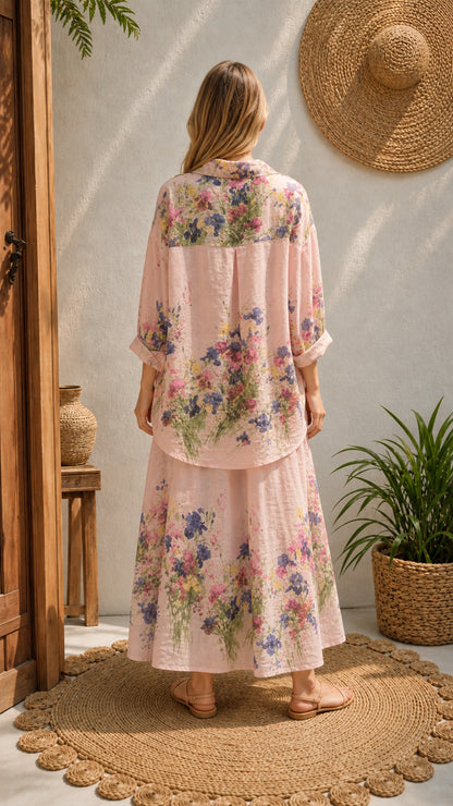 Back view of woman wearing pink floral button-down shirt and maxi skirt set