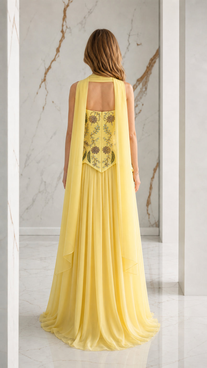 Back view of yellow chiffon evening dress showing matching capelet scarf drape