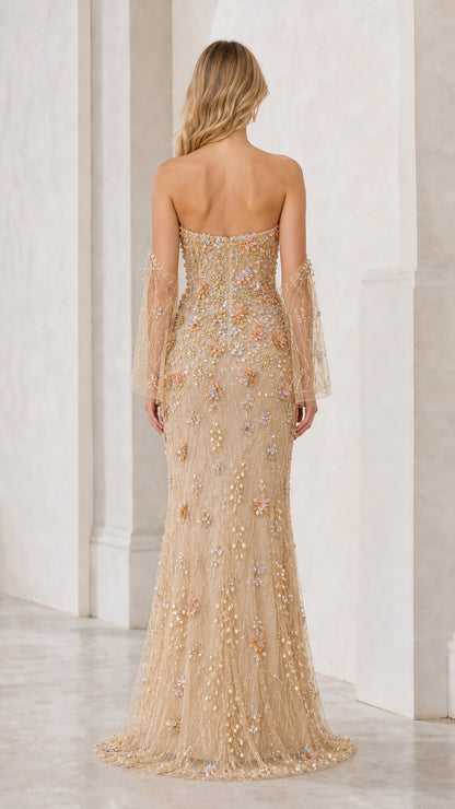 Back view of champagne strapless evening dress with sweep train