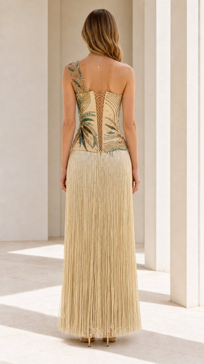 Back view showing corset-style back detail of the gold fringe dress