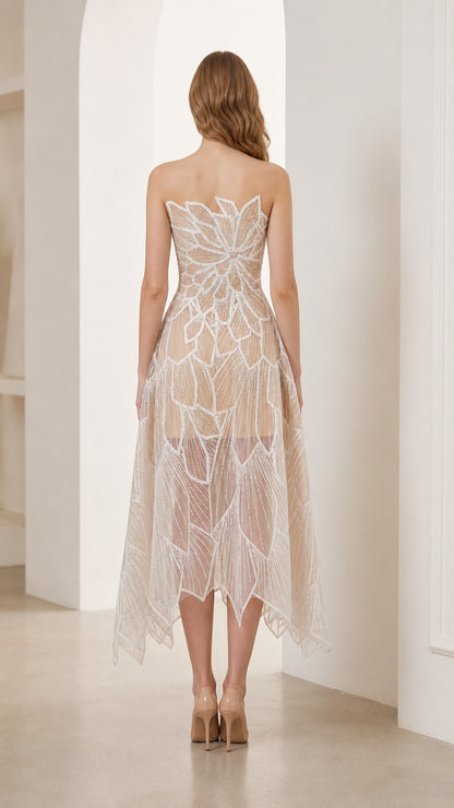 Back view of strapless champagne midi dress with scalloped back and sheer tulle skirt