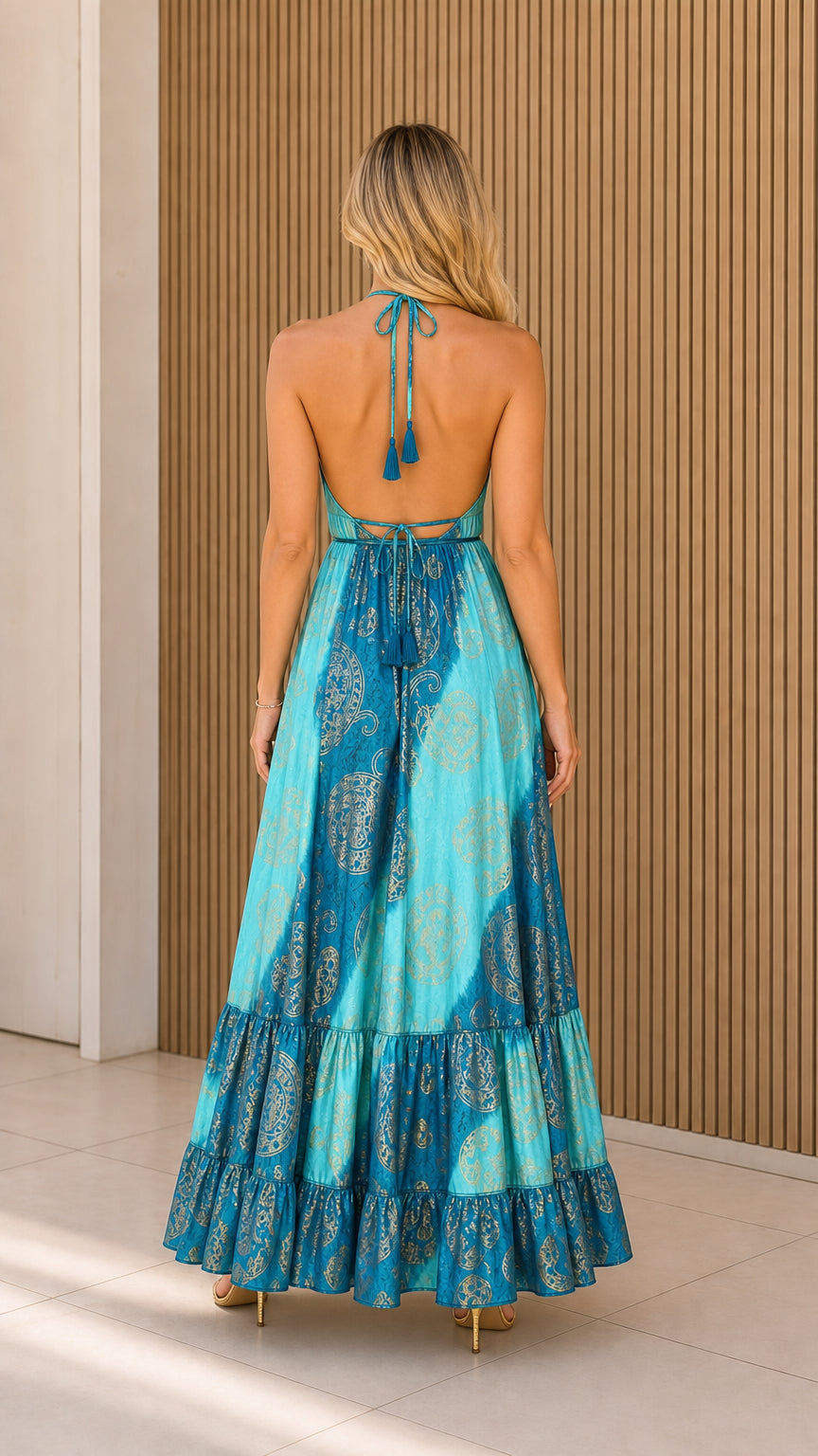 Back view of model showing halter neck tie and tassel details
