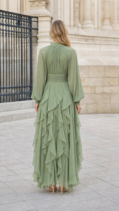 Back view of model in sage green pleated bodice chiffon maxi dress