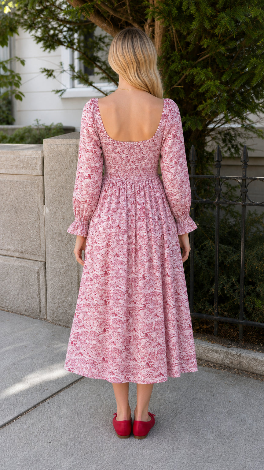 Model wearing red vintage toile print midi dress back view