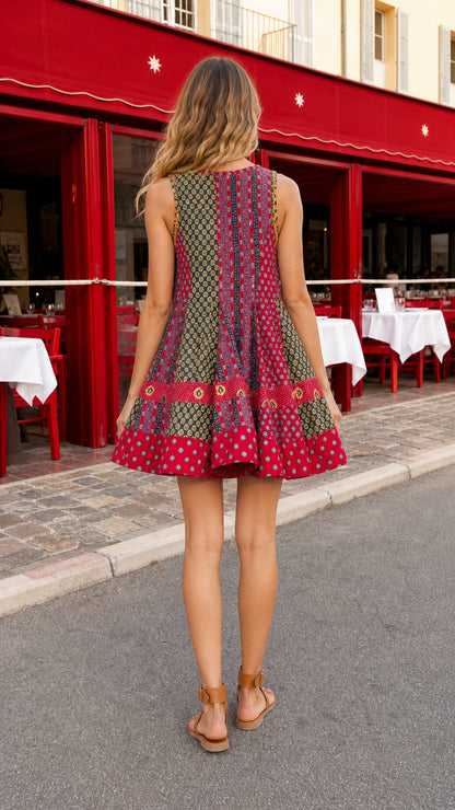 Boho patchwork print mini swing dress in red back view