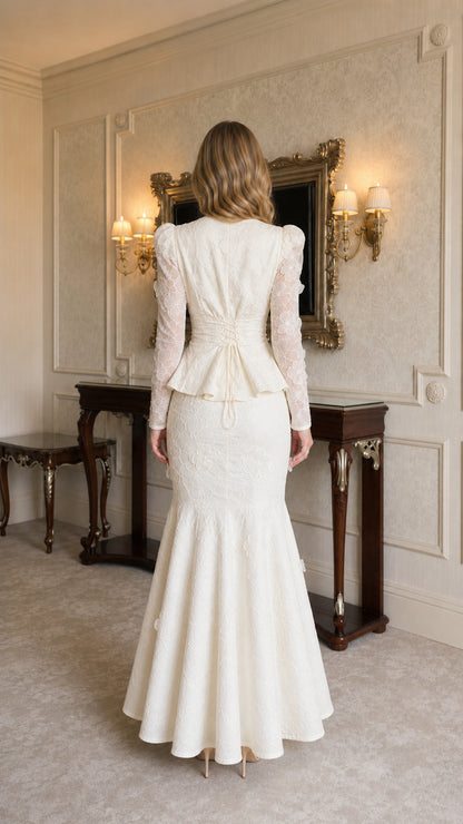 Model wearing ivory lace two-piece set, back view showing flared hem
