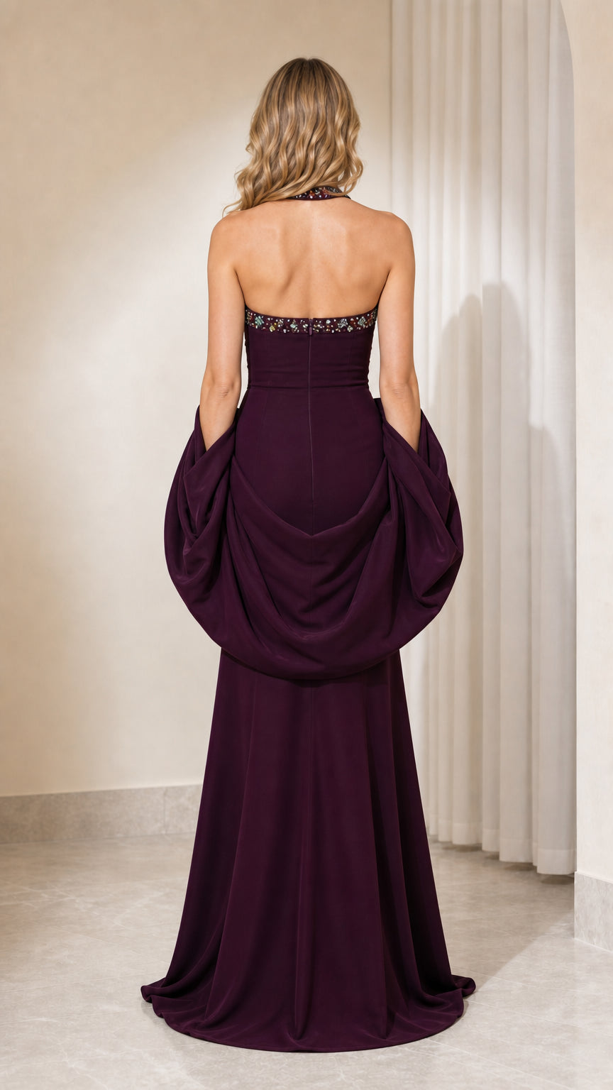 Back view of plum formal dress showing draping